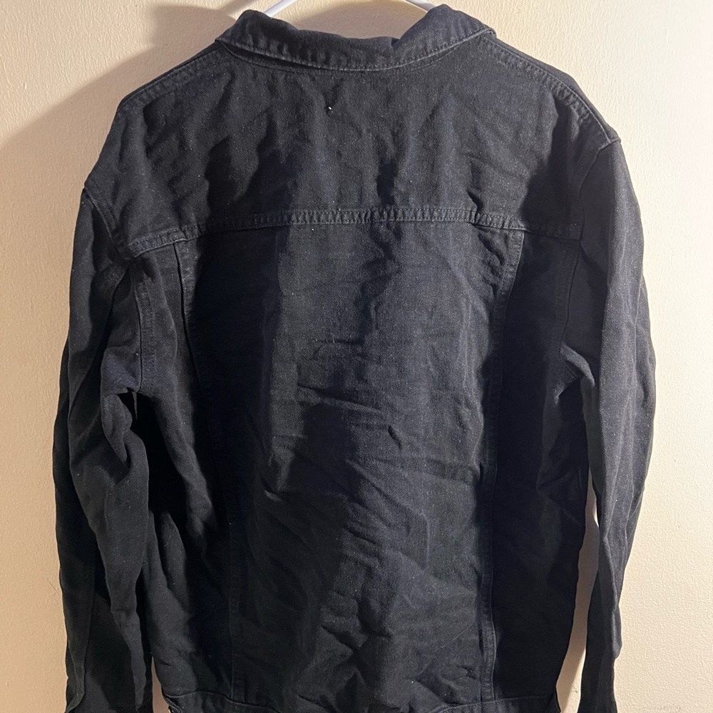 Black denim jacket with silver buttons